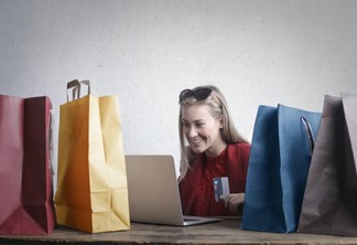 happy woman shopping online at home